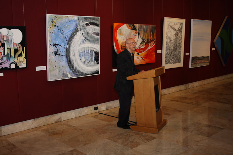 Dr Ojārs Greste, President of the Australian Latvian Artists Association introduced the guest speaker, the Hon. David Clarke, MLC. Paintings by Biruta Clark, Andra Krūmiņa, Walter Barda.