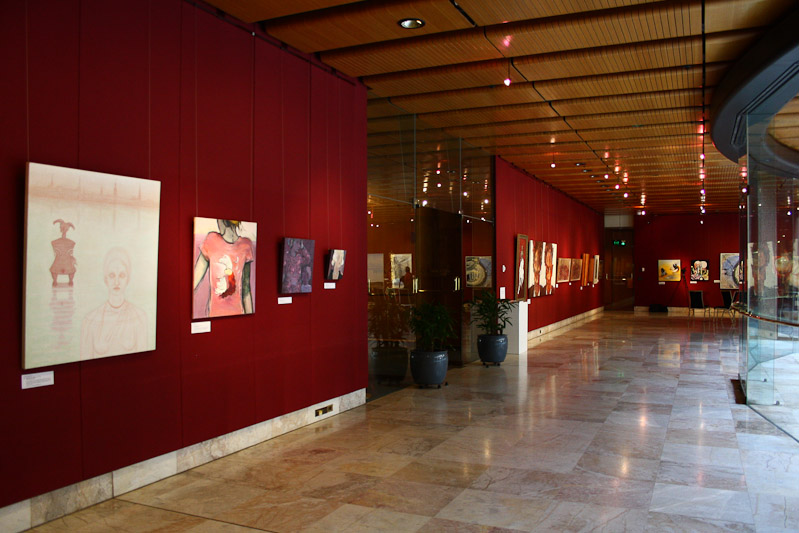 East wall with paintings by Anita Rezevska, Dzidra Mitchell, Andra Krūmiņa, Pēteris Ciemītis, Juris Ceriņš, Harijs Piekalns, Jan Senbergs